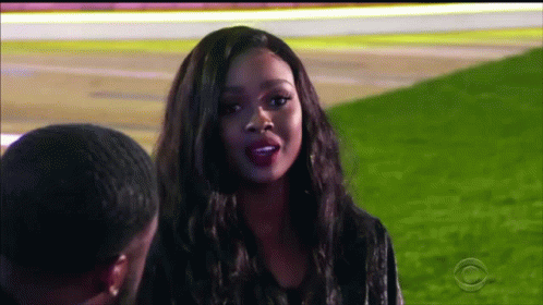Woman Talking To Man In Field GIF