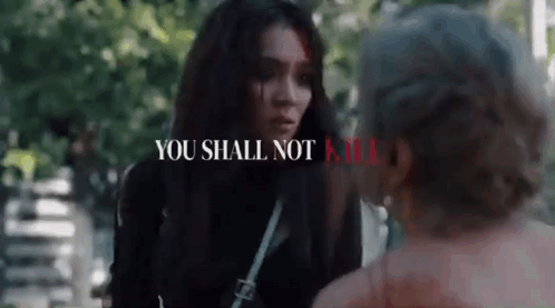 Woman Talking to Man in Park Saying You Shall Not Kill