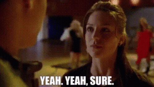 Woman Talking To Man Saying Yeah Yeah Sure GIF