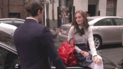 Woman Talking to Man with License Plate TNM