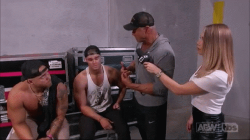Woman Talking To Man With Microphone GIF