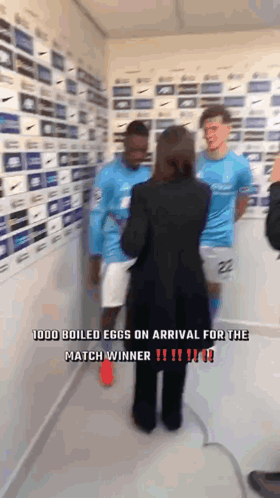 Woman Talking to Two Soccer Players in Room Saying 1000 Boiled Eggs on Arrival for the Match Winner