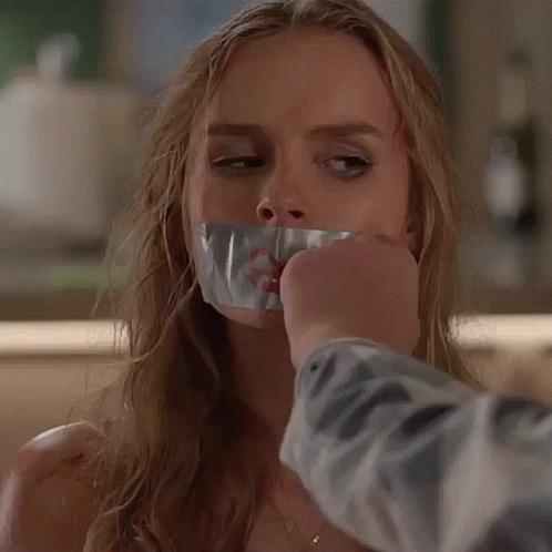 Woman Taped To Table With Duct Tape On Mouth GIF