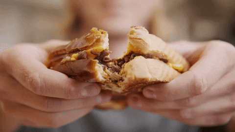 Woman Tearing Waffles With Chocolate Filling GIF