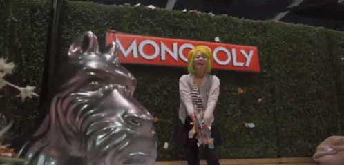 Woman Throwing Monopoly Money Into Air GIF