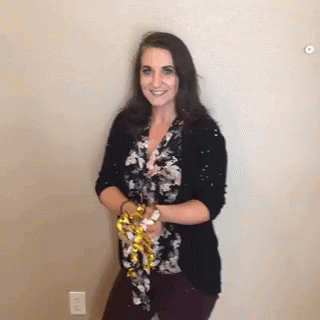 Woman Throws The Confetti Cannon GIF