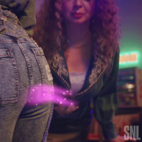 Woman Touching Another Woman's Butt With Purple Glow