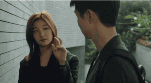 Woman Touching Man's Face GIF