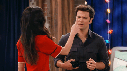 Woman Touching Man's Nose GIF