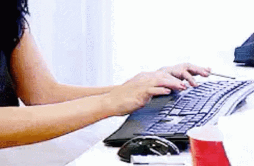 Woman Typing on Computer Keyboard