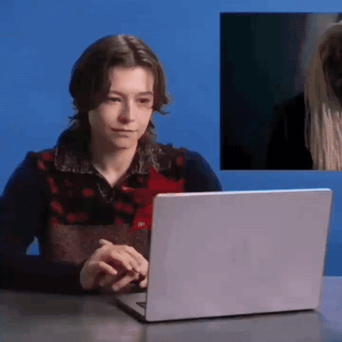 Woman Typing on Laptop