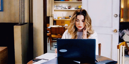 Woman Using Laptop With Microsoft Sticker
