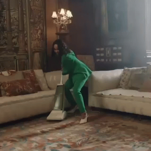 Woman Using Vacuum On Carpet GIF