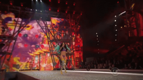 Woman Walking Down Runway At Fashion Show GIF