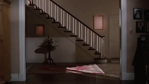 Woman Walking Down Stairs GIF