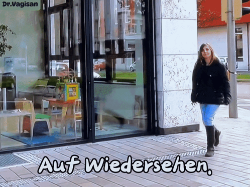 Woman Walking in Front of Store Auf Wiedersehen