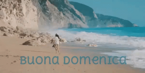 Woman Walking on Beach with Buona Domenica in Blue