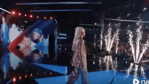 Woman Walking On Stage With Run Logo GIF