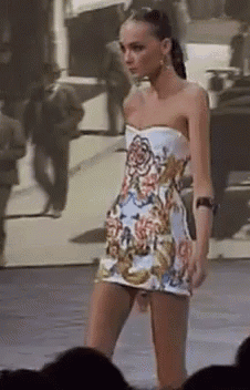 Woman Walking Runway in Strapless Dress