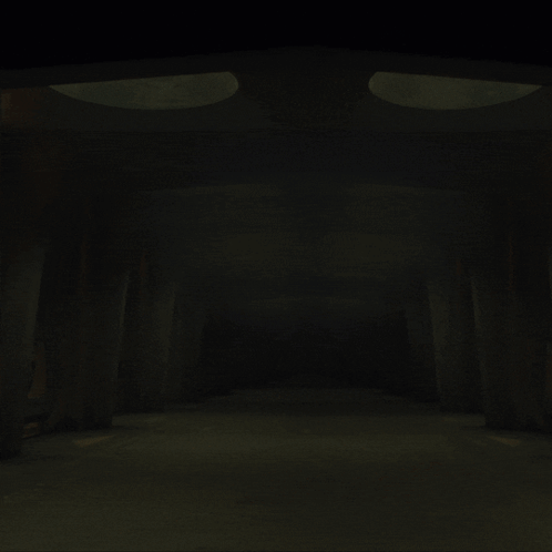 Woman Walking Through Dark Hallway With Spotlights