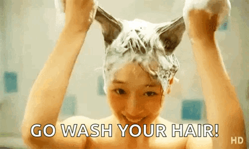 Woman Washing Hair in Bathtub With Cat Ears