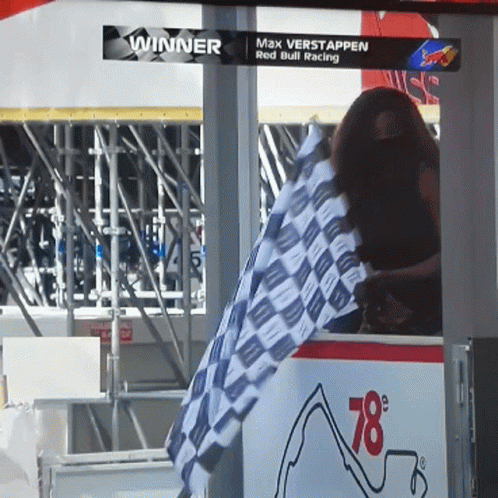 Woman Waving Checkered Race Flag GIF
