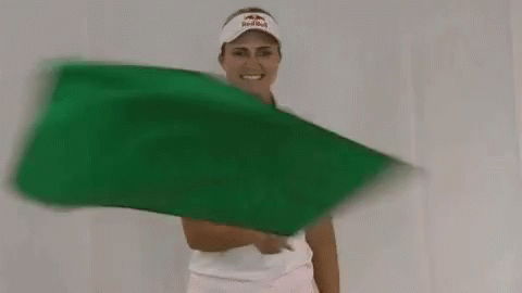 Woman Waving Green Flag
