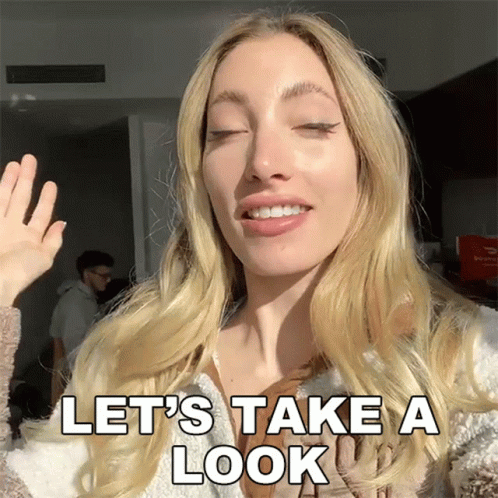 Woman Waving Hand Saying Let's Take a Look