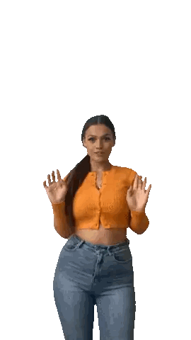 Woman Waving in Crop Top and Jeans