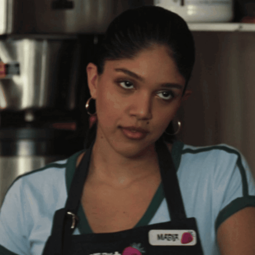 Woman Wearing Apron and Name Tag Marisha