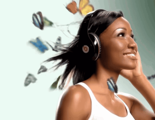 Woman Wearing Beats Headphones With Butterflies