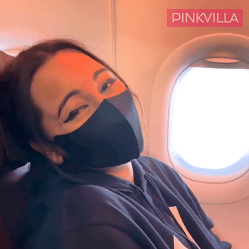 Woman Wearing Black Mask on Plane