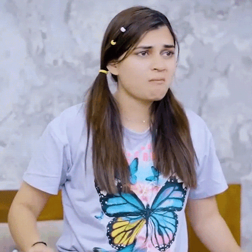 Woman Wearing Butterfly T-Shirt Making Funny Face GIF