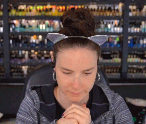 Woman Wearing Cat Ear Headband and Earrings
