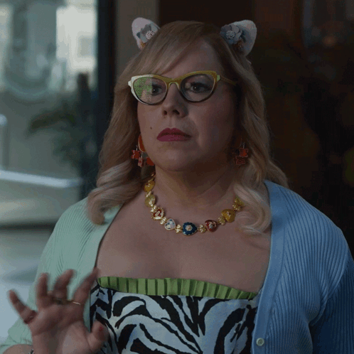 Woman Wearing Cat Ear Headband And Glasses GIF
