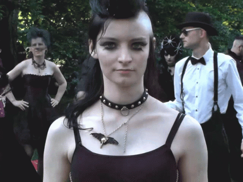Woman Wearing Choker and Bat Necklace