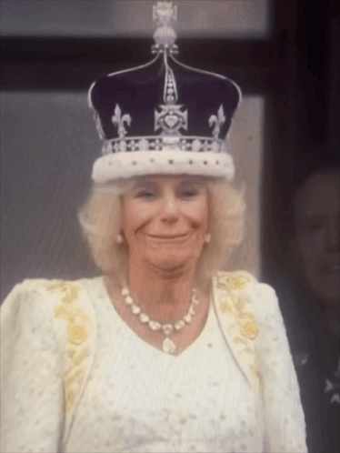 Woman Wearing Crown And Pearl Necklace Smiling GIF