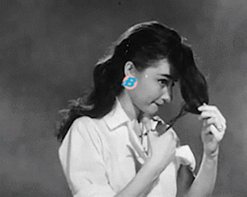 Woman Wearing Earrings With Letter B