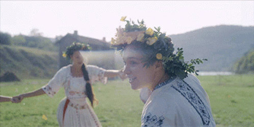 Woman Wearing Flower Wreath Holding Nose GIF