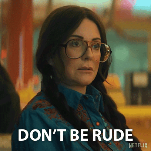 Woman Wearing Glasses and Blue Shirt Saying Don't Be Rude
