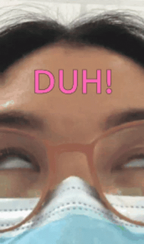 Woman Wearing Glasses And Face Mask Says Duh GIF
