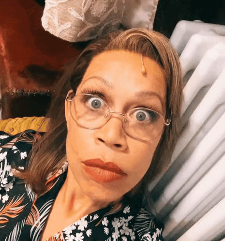 Woman Wearing Glasses And Floral Shirt GIF