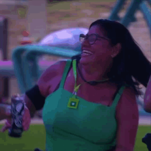 Woman Wearing Glasses and Green Tank Top Laughing Holding Soda