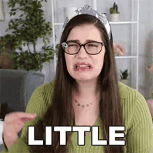 Woman Wearing Glasses and Headband Making Funny Face