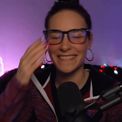 Woman Wearing Glasses And Hoop Earrings Smiling GIF
