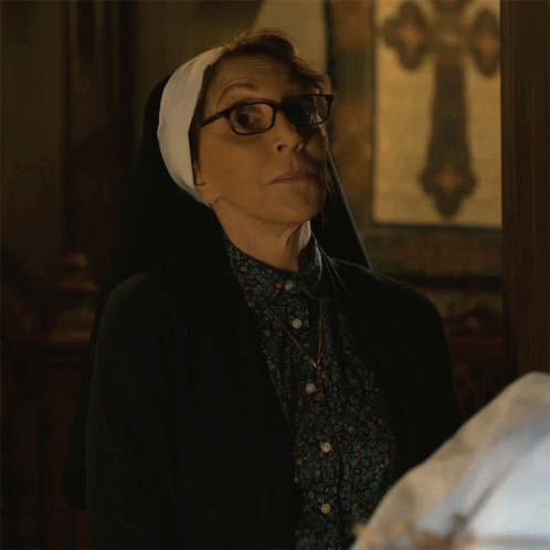 Woman Wearing Glasses and Nun's Veil