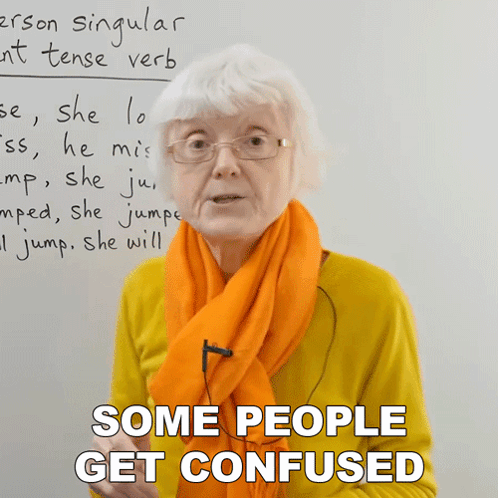 Woman Wearing Glasses And Orange Scarf Says Some People Get Confused GIF