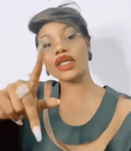 Woman Wearing Glasses and Red Lipstick Pointing
