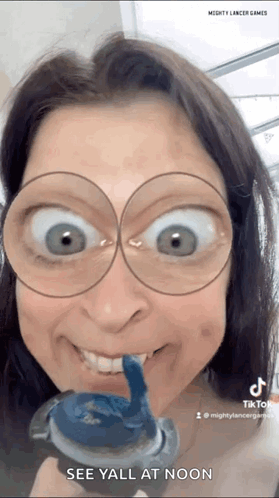 Woman Wearing Glasses Holding Toothpaste