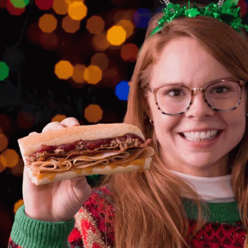 Woman Wearing Glasses Holding Turkey Sub GIF